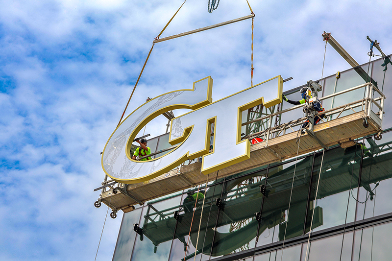 GT logo being installed on George Tower | Scheller Tower.