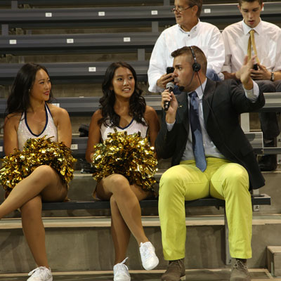 Stephen Norris talking to cheerleaders